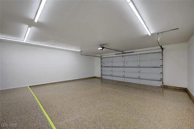 2050 W Warm Springs Rd Unit 4512, Henderson, NV 89014 - garage with baseboards and a garage door opener