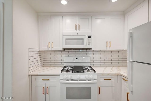 2050 W Warm Springs Rd Unit 4512, Henderson, NV 89014 - kitchen with white appliances, white cabinets, light stone counters, tasteful backsplash, and recessed lighting