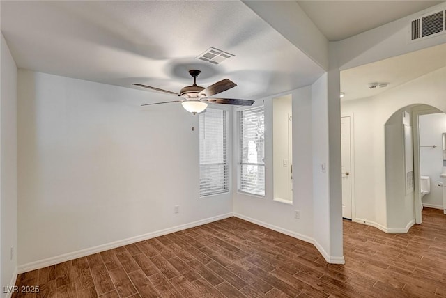 2050 W Warm Springs Rd Unit 4512, Henderson, NV 89014 - unfurnished room with arched walkways, wood finished floors, and a ceiling fan