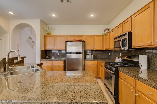 10952 Porto Foxi St, Las Vegas, NV 89141 - kitchen featuring stainless steel appliances, tile countertops, tasteful backsplash, and recessed lighting