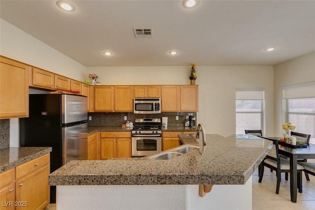 10952 Porto Foxi St, Las Vegas, NV 89141 - kitchen featuring appliances with stainless steel finishes, tile counters, decorative backsplash, recessed lighting, and light tile patterned floors