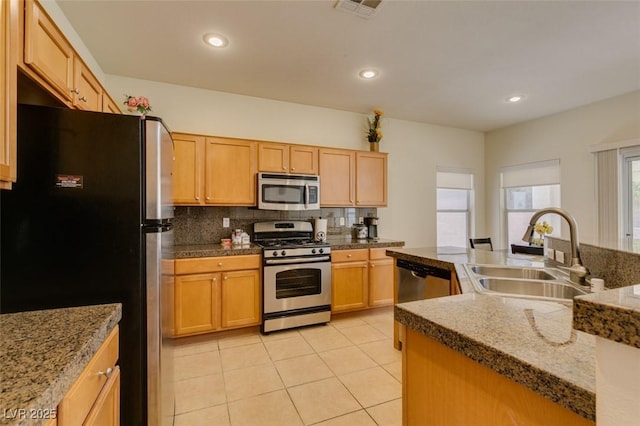 10952 Porto Foxi St, Las Vegas, NV 89141 - kitchen with appliances with stainless steel finishes, tasteful backsplash, light tile patterned floors, and recessed lighting