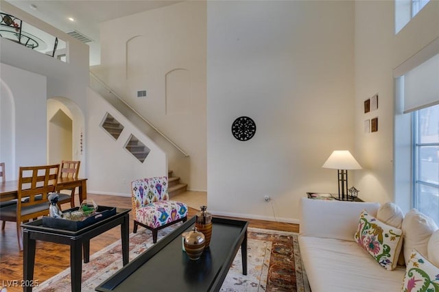 10952 Porto Foxi St, Las Vegas, NV 89141 - living area with a towering ceiling, wood finished floors, and stairs
