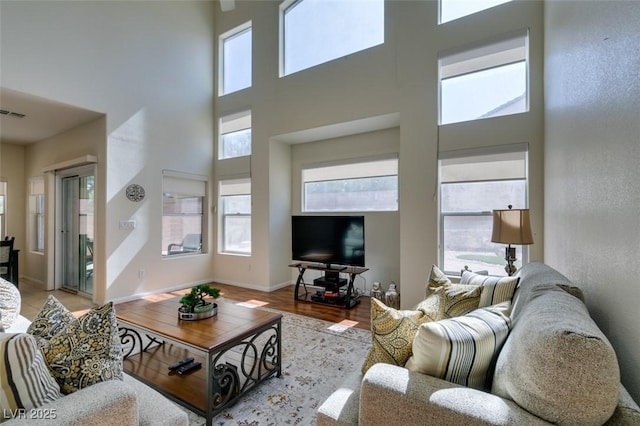 10952 Porto Foxi St, Las Vegas, NV 89141 - living room featuring a high ceiling and wood finished floors