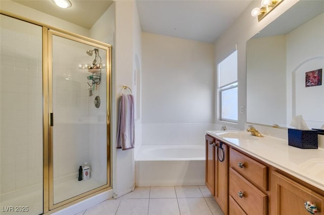 10952 Porto Foxi St, Las Vegas, NV 89141 - bathroom featuring a shower stall, a bath, double vanity, and tile patterned flooring