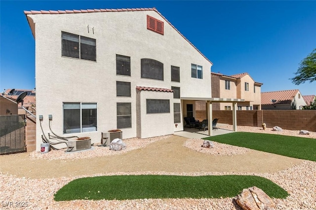 10952 Porto Foxi St, Las Vegas, NV 89141 - rear view of house featuring stucco siding, a patio, a fenced backyard, and a tiled roof