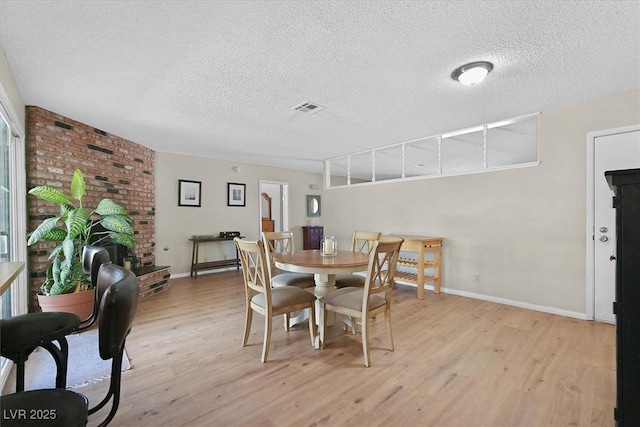 7113 Carrondale Way, Las Vegas, NV 89128 - dining space featuring light wood-style floors and a textured ceiling