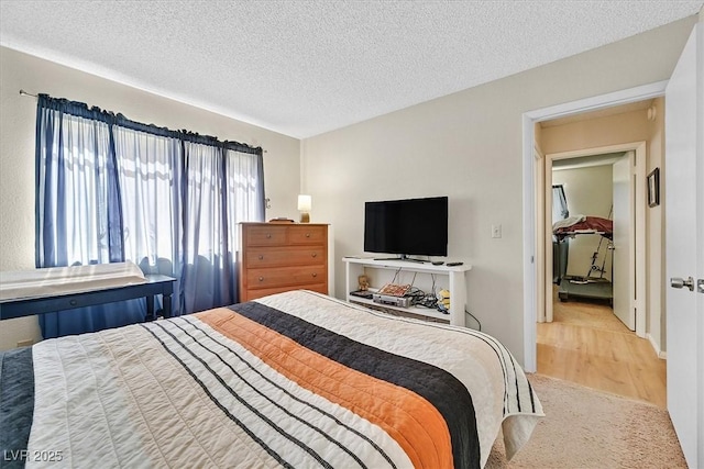 7113 Carrondale Way, Las Vegas, NV 89128 - bedroom featuring a textured ceiling and wood finished floors