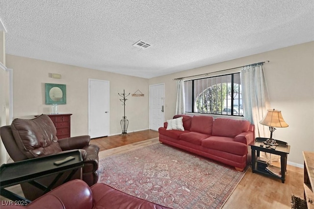 7113 Carrondale Way, Las Vegas, NV 89128 - living room with wood finished floors and a textured ceiling