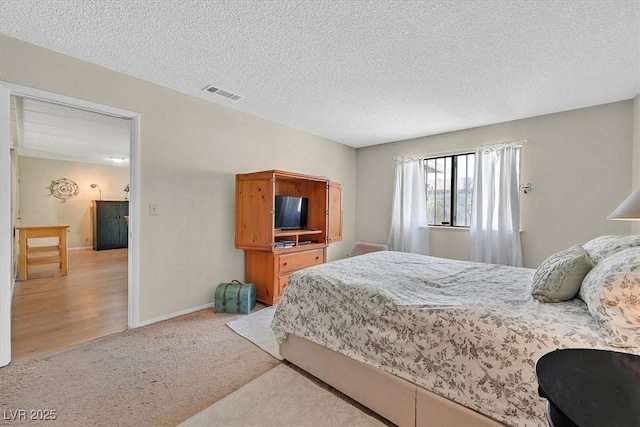 7113 Carrondale Way, Las Vegas, NV 89128 - bedroom featuring light carpet and a textured ceiling