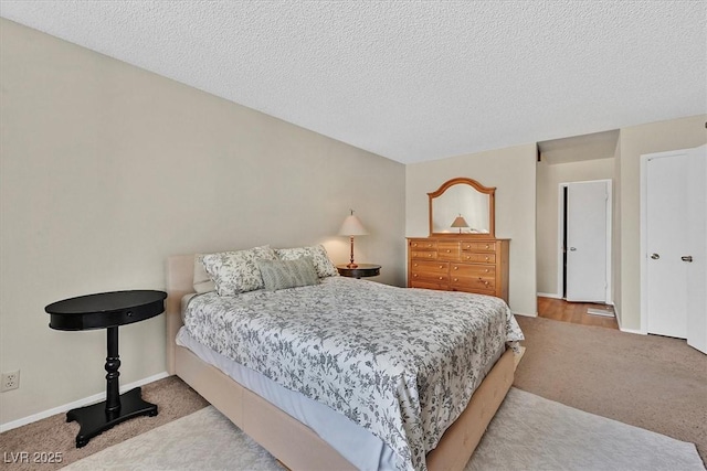 7113 Carrondale Way, Las Vegas, NV 89128 - carpeted bedroom featuring a textured ceiling and baseboards