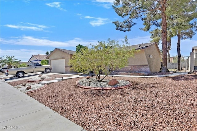 7113 Carrondale Way, Las Vegas, NV 89128 - view of front facade featuring stucco siding, brick siding, and an attached garage