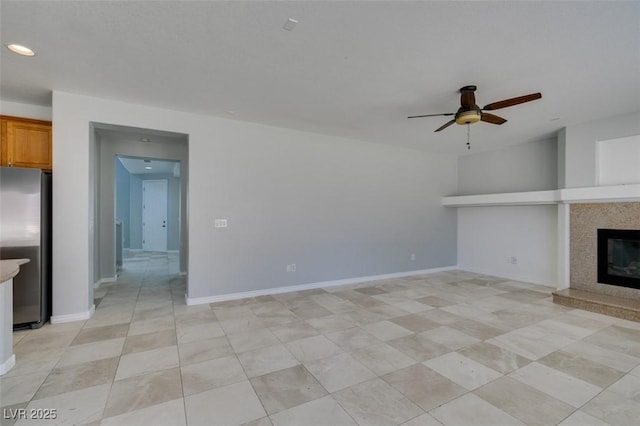 3941 Copper Stone Ct, North Las Vegas, NV 89032 - unfurnished living room with a ceiling fan, a high end fireplace, and recessed lighting