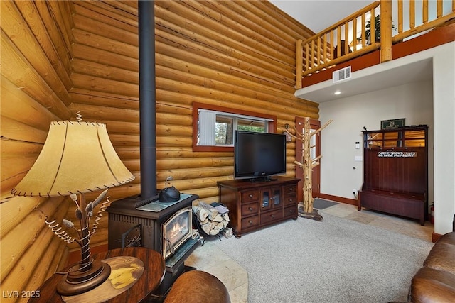 401 Alpine Way, Mount Charleston, NV 89124 - living area featuring a wood stove, rustic walls, and a high ceiling