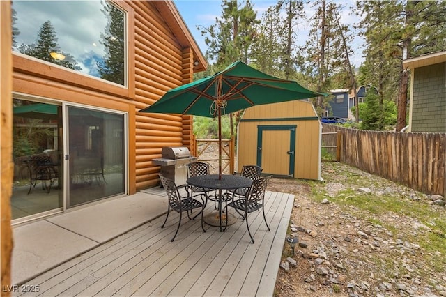 401 Alpine Way, Mount Charleston, NV 89124 - wooden terrace with a shed, outdoor dining area, a fenced backyard, and area for grilling