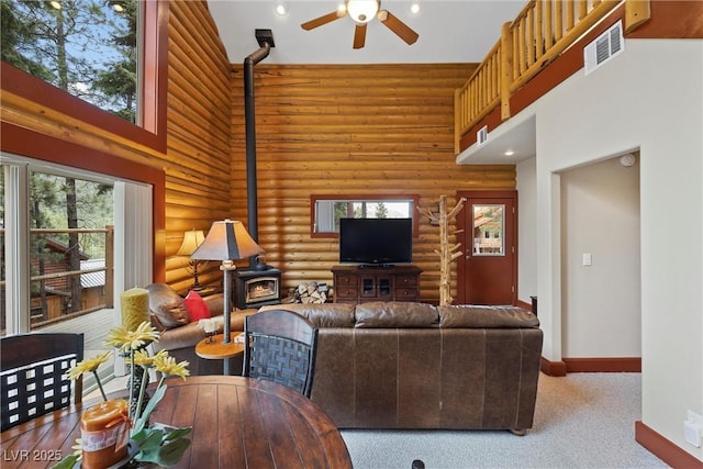 401 Alpine Way, Mount Charleston, NV 89124 - living area with a wood stove, a high ceiling, rustic walls, a ceiling fan, and recessed lighting