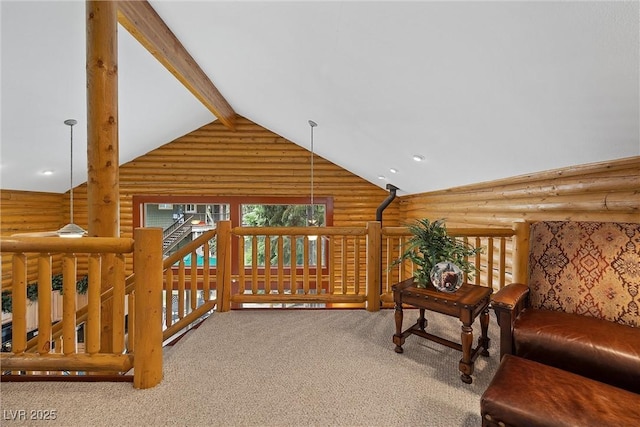 401 Alpine Way, Mount Charleston, NV 89124 - carpeted living area with log walls, beam ceiling, and high vaulted ceiling