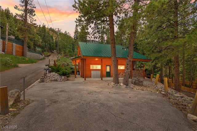 401 Alpine Way, Mount Charleston, NV 89124 - view of front of property with asphalt driveway, faux log siding, and a metal roof