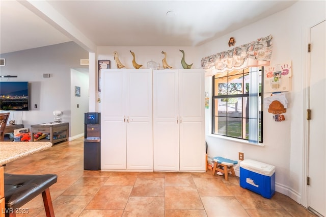 1723 Candice St, Las Vegas, NV 89156 - kitchen featuring white cabinetry and lofted ceiling