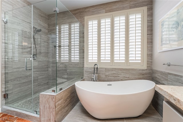 10331 Rio De Thule Ln, Las Vegas, NV 89135 - full bath featuring tile walls, a freestanding tub, a shower stall, and vanity