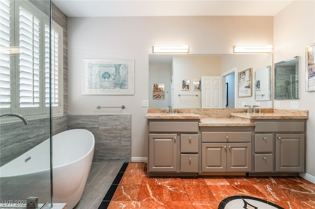 10331 Rio De Thule Ln, Las Vegas, NV 89135 - full bathroom with double vanity, a soaking tub, plenty of natural light, and marble finish flooring