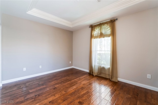 10331 Rio De Thule Ln, Las Vegas, NV 89135 - unfurnished room featuring crown molding, dark wood-type flooring, and a tray ceiling