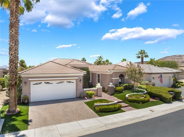 10331 Rio De Thule Ln, Las Vegas, NV 89135 - mediterranean / spanish home with stucco siding, driveway, a tile roof, and an attached garage