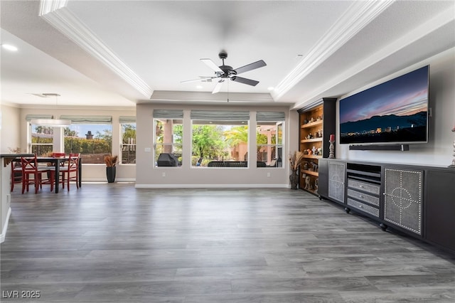 10331 Rio De Thule Ln, Las Vegas, NV 89135 - unfurnished living room with crown molding, a tray ceiling, wood finished floors, ceiling fan, and recessed lighting