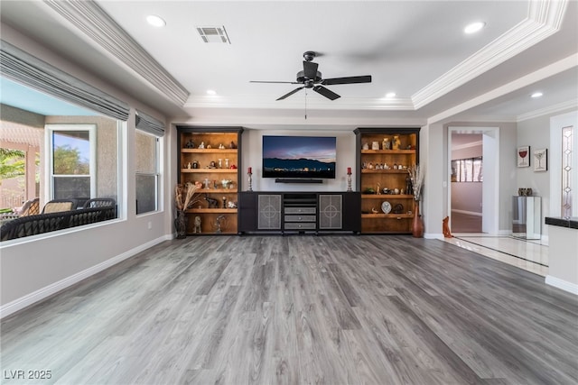 10331 Rio De Thule Ln, Las Vegas, NV 89135 - living room with ceiling fan, crown molding, wood finished floors, a tray ceiling, and recessed lighting