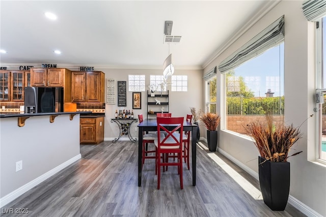 10331 Rio De Thule Ln, Las Vegas, NV 89135 - dining area featuring ornamental molding, recessed lighting, and dark wood-style floors