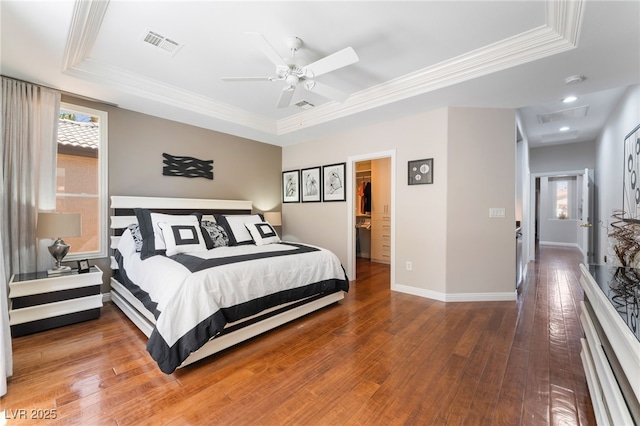 10331 Rio De Thule Ln, Las Vegas, NV 89135 - bedroom with a raised ceiling, ornamental molding, wood-type flooring, attic access, and a ceiling fan