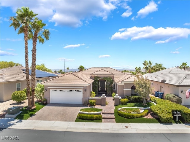 10331 Rio De Thule Ln, Las Vegas, NV 89135 - mediterranean / spanish home with stucco siding, an attached garage, driveway, and a tile roof