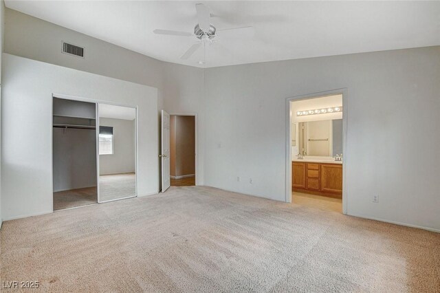 1981 Spring Lake Dr, Henderson, NV 89002 - unfurnished bedroom featuring light carpet, a closet, ensuite bathroom, and ceiling fan