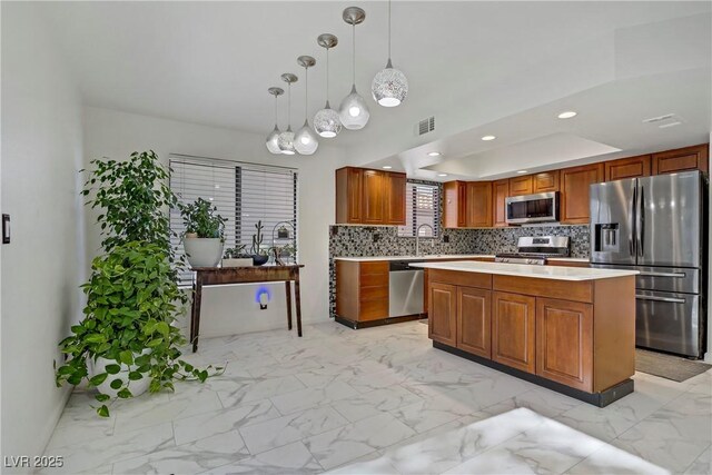 117 Lotus Blossom Ct, Las Vegas, NV 89145 - kitchen featuring appliances with stainless steel finishes, light countertops, decorative backsplash, light marble finish flooring, and recessed lighting