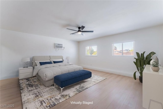 313 Agora Way, Las Vegas, NV 89110 - bedroom featuring wood finished floors, ceiling fan, and a wall mounted air conditioner