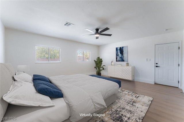 313 Agora Way, Las Vegas, NV 89110 - bedroom with wood finished floors and a ceiling fan