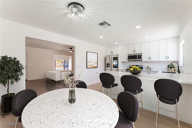 313 Agora Way, Las Vegas, NV 89110 - dining space with light wood-style flooring and recessed lighting