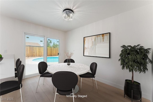 313 Agora Way, Las Vegas, NV 89110 - dining room featuring wood finished floors and a chandelier