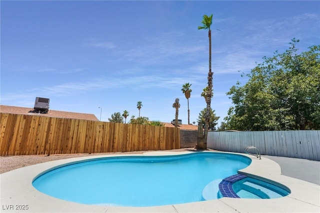 313 Agora Way, Las Vegas, NV 89110 - view of swimming pool with a pool with connected hot tub and a fenced backyard