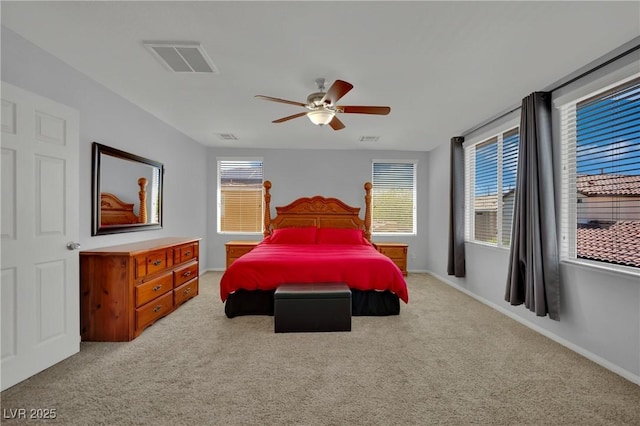 9131 Grand Sunburst Ct, Las Vegas, NV 89149 - carpeted bedroom with multiple windows and ceiling fan