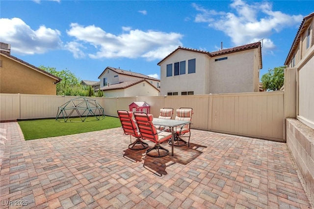 9131 Grand Sunburst Ct, Las Vegas, NV 89149 - fenced backyard with a patio area and outdoor dining space