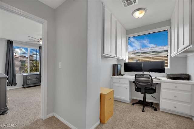 9131 Grand Sunburst Ct, Las Vegas, NV 89149 - home office featuring light colored carpet and a ceiling fan