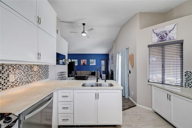 1708 Anzio St, Las Vegas, NV 89108 - kitchen featuring a ceiling fan, stainless steel dishwasher, white cabinetry, tasteful backsplash, and a peninsula
