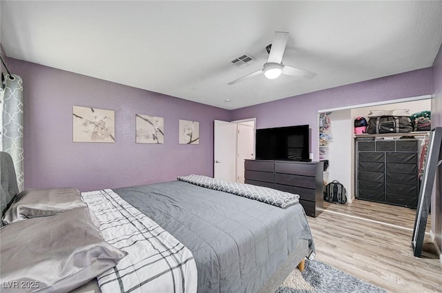 1708 Anzio St, Las Vegas, NV 89108 - bedroom with light wood finished floors, ceiling fan, a textured wall, and a closet