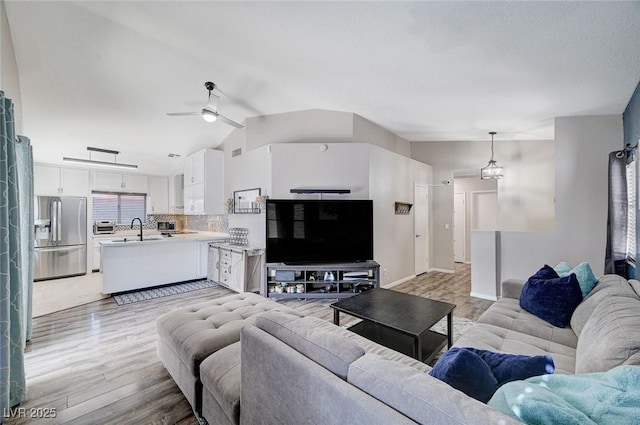 1708 Anzio St, Las Vegas, NV 89108 - living room featuring light wood-style floors, ceiling fan, and vaulted ceiling