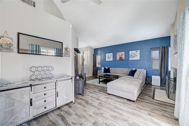 1708 Anzio St, Las Vegas, NV 89108 - living area featuring light wood-style floors and vaulted ceiling