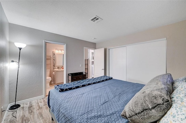 1708 Anzio St, Las Vegas, NV 89108 - bedroom with light wood finished floors, a closet, and connected bathroom