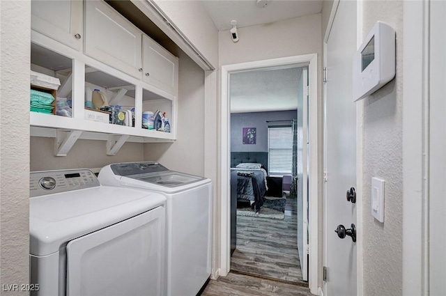 1708 Anzio St, Las Vegas, NV 89108 - laundry area featuring cabinet space, separate washer and dryer, and wood finished floors