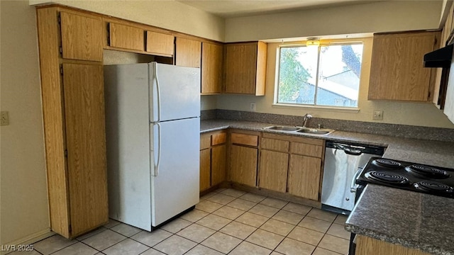 3412 Mercury St Unit I, North Las Vegas, NV 89030 - kitchen featuring freestanding refrigerator, dishwasher, range, dark countertops, and light tile patterned flooring