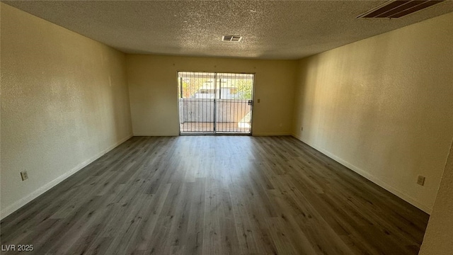 3412 Mercury St Unit I, North Las Vegas, NV 89030 - unfurnished room featuring wood finished floors, a textured wall, and a textured ceiling